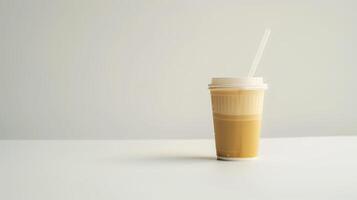 Image of a plastic straw and disposable coffee cup on a white table with a white background photo