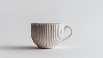 Modern white ceramic mug with a simple design is standing on a white background photo
