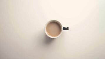 Focused atmosphere is created by a steaming cup of coffee placed on a minimalistic white photo