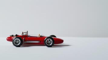 Red toy race car on a white background symbolizing speed, competition, and racing photo