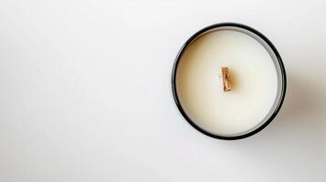 Wooden wick scented candle in white, set against a serene white backdrop photo