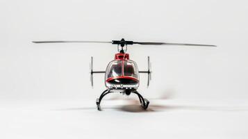 Vivid red plastic model helicopter with extended rotor blades on a white background photo