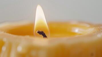 Mesmerizing close-up of a burning candle melting into a pool of wax photo
