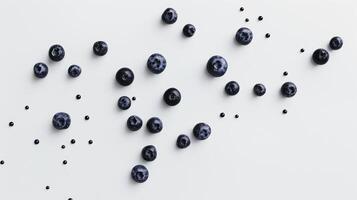 Fresh blueberries and drops of juice scattered on white background forming a texture, top view photo