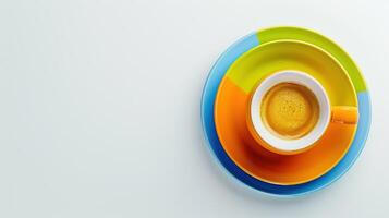 Colorful stack of plates with a cup of coffee adds a pop of color to the plain white backdrop photo