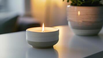 Scented candle is emitting a warm glow, adding a cozy ambiance to a home photo