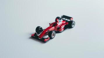 Red race car standing on white background, concept of speed, competition or childhood photo