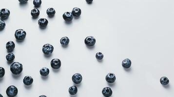 Fresh blueberries arranged in a pattern on a white background. photo