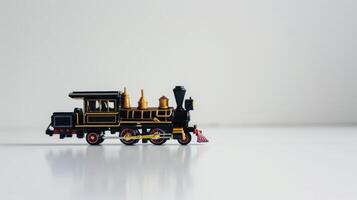 Black and gold toy train on a white background, evoking feelings of travel, nostalgia, photo