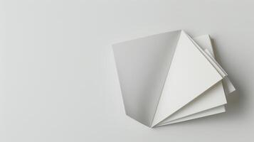 Blank magazine displayed with pages fanning out to create an abstract geometric design photo