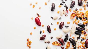 Diverse dried kidney beans arranged on a white backdrop, forming a border with space for text photo