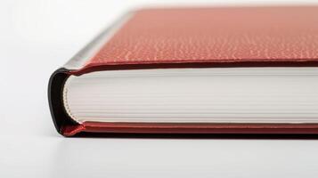 Red book with leather cover closed lying on white background, close-up, copy space photo