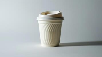 White disposable coffee cup with plastic lid on white background, casting a bold shadow. photo
