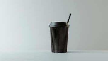 Black coffee cup with a matching lid and straw is placed on a white surface with a white background photo
