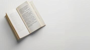 White table with an open book and blank space, ideal for a book cover or advertisement photo