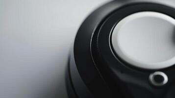 Modern wireless headphones with a close-up focus on the volume control photo