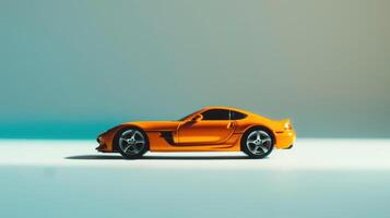 Elegant orange sports car on a blue and white backdrop in a studio, radiating luxury and performance photo