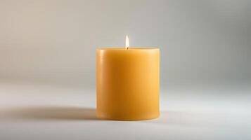 Vibrant yellow candle illuminates a neutral background, exuding warmth and optimism photo