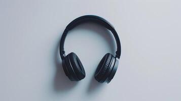 Black wireless headphones on a white background, displaying their stylish and contemporary design photo