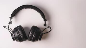 Black headphones on a white background, symbolizing music, podcasts, and audio entertainment photo
