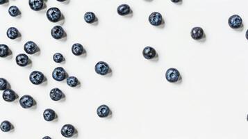 White surface covered with numerous blueberries, forming a wholesome and natural food backdrop photo