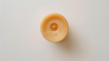 Scented candle with a short wick, bringing warmth and relaxation when extinguished photo