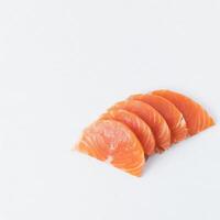 Sliced of salmon meat isolated on white background photo
