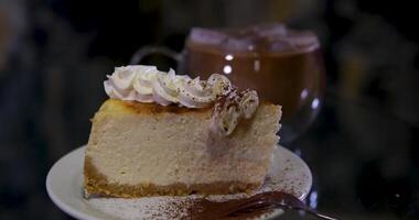 Dusting cocoa powder on chocolate cheesecake sprinkle cocoa on cheesecake video