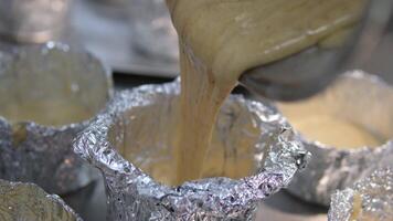 Beating eggs with an electric mixer for sponge biscuit cake dough.. process of baking rich bread in homemade foil molds. Preparing the batter for the bent cake video