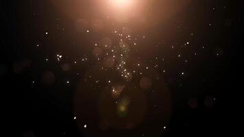 Golden particles falling down bokeh abstract background with shining gold Dust Particles Flare star on Black Background in Slow Motion. Futuristic glittering fly movement flickering loop in space. video