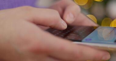 Close-up of hands typing on a smartphone with a virtual keyboard video