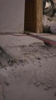 A hammer drill breaks concrete in a detailed close-up, showcasing the intense force and precision of the hammer drill as it works through solid surfaces with a powerful drill bit. video