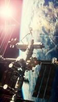 International Space Station in outer space over the planet Earth orbit, vertical video