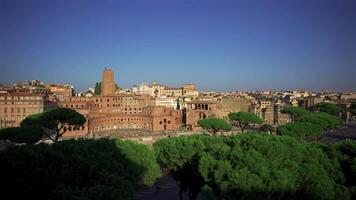 Overhead view of Rome city and coliseum from observation deck Atrio della liberta. Rome skyline and Colosseum from viewing point Piazza Venezia. Top view of Rome city with Colosseum and Roman Forum. video