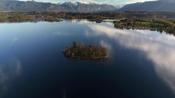 Aerial view, Staffelsee with islands, Garmisch Partenkirchen region, Bavaria, Germany near Murnau in sunny weather at sunset in spring. Drone view over islands of a large beautiful lake in Bayern. video
