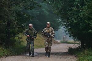 A disciplined and specialized military unit, donned in camouflage, strategically patrolling and maintaining control in a high-stakes environment, showcasing their precision, unity, and readiness for photo