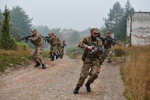 A disciplined and specialized military unit, donned in camouflage, strategically patrolling and maintaining control in a high-stakes environment, showcasing their precision, unity, and readiness for photo