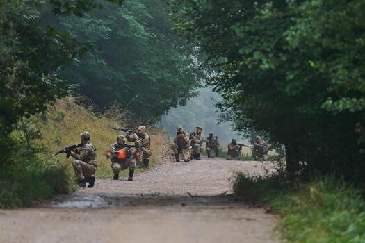 Elite military unit parading and securing the forest, utilizing drones for terrain scanning and reconnaissance, showcasing their advanced skills and specialized training in high risk operations photo