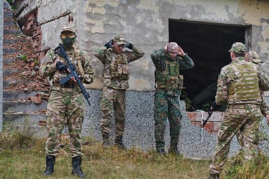 In a high stakes mission, a specialized military unit executes a tactical operation to secure a dangerous house where terrorists are believed to be hiding, showcasing precision and coordinated photo