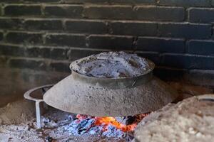 Capturing the essence of Bosnian culinary tradition, step-by-step preparation of a traditional Bosnian pie, showcasing the meticulous craftsmanship and authentic flavors involved in the culinary photo