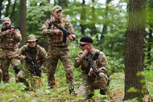 A disciplined and specialized military unit, donned in camouflage, strategically patrolling and maintaining control in a high-stakes environment, showcasing their precision, unity, and readiness for photo