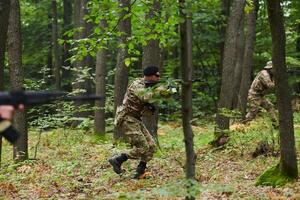 A disciplined and specialized military unit, donned in camouflage, strategically patrolling and maintaining control in a high-stakes environment, showcasing their precision, unity, and readiness for photo