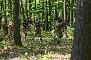 A specialized military antiterrorist unit conducts a covert operation in dense, hazardous woodland, demonstrating precision, discipline, and strategic readiness photo