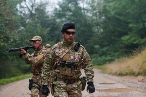 A disciplined and specialized military unit, donned in camouflage, strategically patrolling and maintaining control in a high-stakes environment, showcasing their precision, unity, and readiness for photo