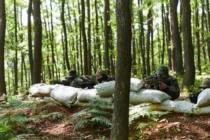A disciplined and specialized military unit, donned in camouflage, strategically patrolling and maintaining control in a high-stakes environment, showcasing their precision, unity, and readiness for photo