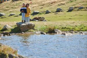 A mother and son create cherished memories as they playfully engage in outdoor activities, their laughter echoing the joy of shared moments and the bond between parent and child photo