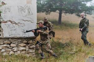 In a high stakes mission, a specialized military unit executes a tactical operation to secure a dangerous house where terrorists are believed to be hiding, showcasing precision and coordinated photo