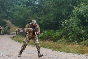 A disciplined and specialized military unit, donned in camouflage, strategically patrolling and maintaining control in a high-stakes environment, showcasing their precision, unity, and readiness for photo