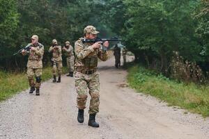 A disciplined and specialized military unit, donned in camouflage, strategically patrolling and maintaining control in a high-stakes environment, showcasing their precision, unity, and readiness for photo