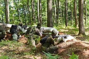 A disciplined and specialized military unit, donned in camouflage, strategically patrolling and maintaining control in a high-stakes environment, showcasing their precision, unity, and readiness for photo